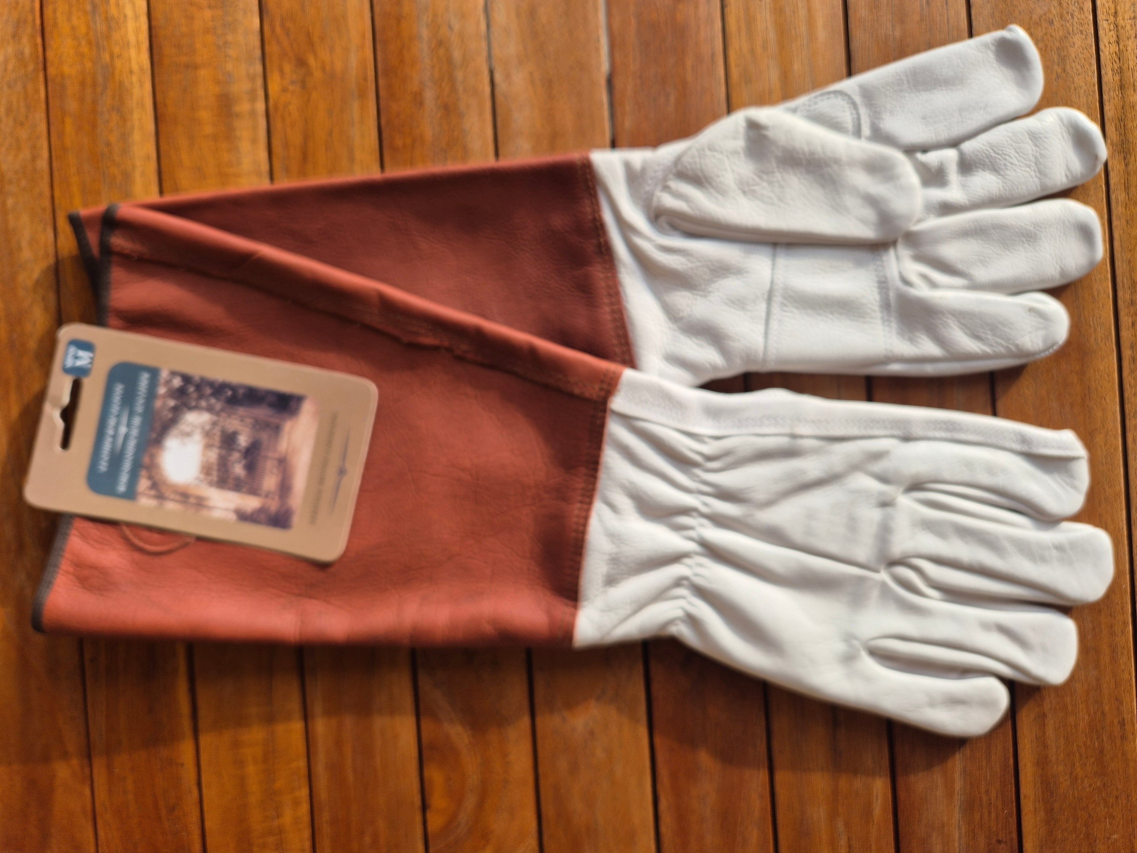 Mens medium rose gloves with long sleeve.