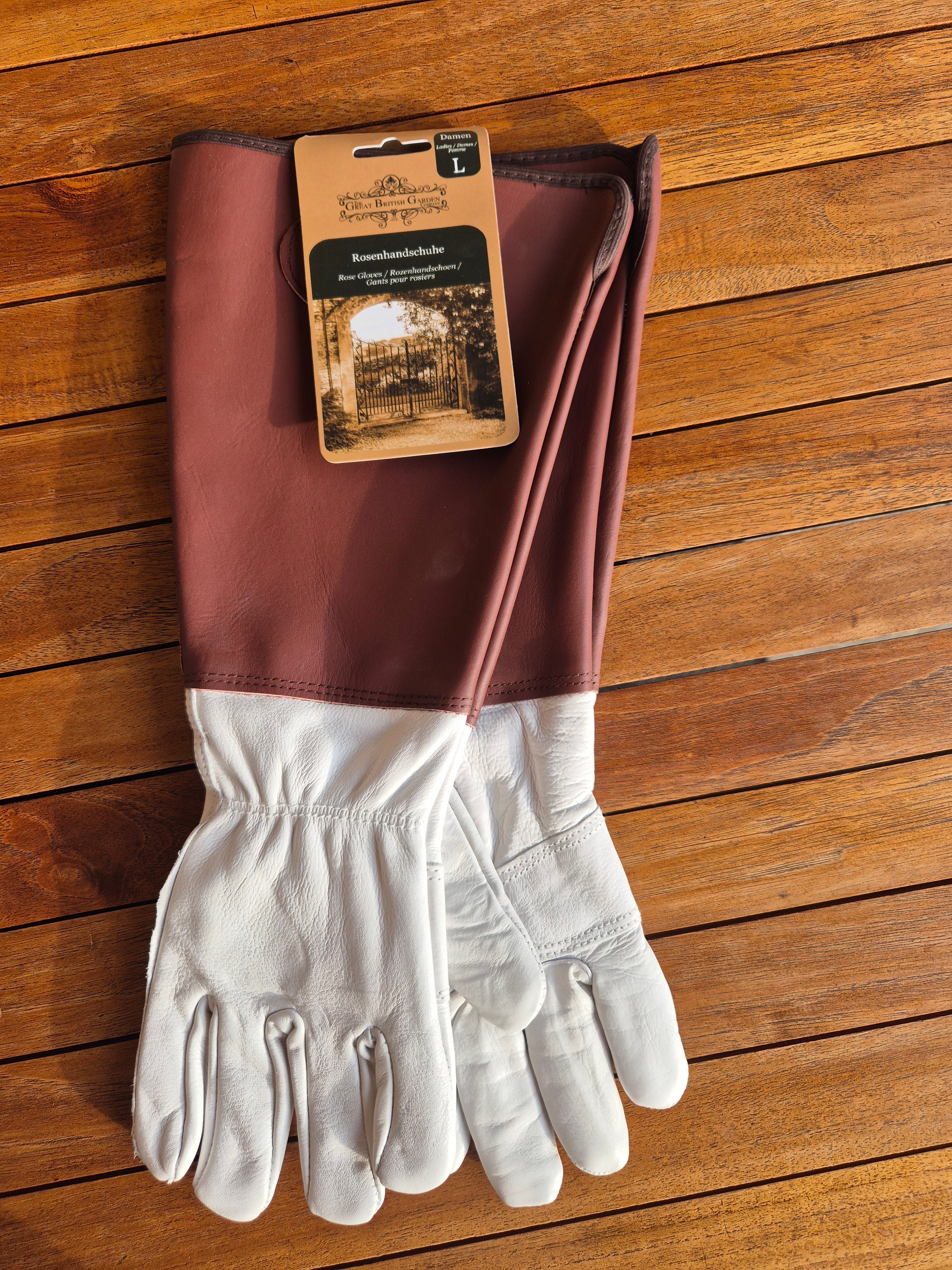 Ladies large leather rose gloves with long sleeve.