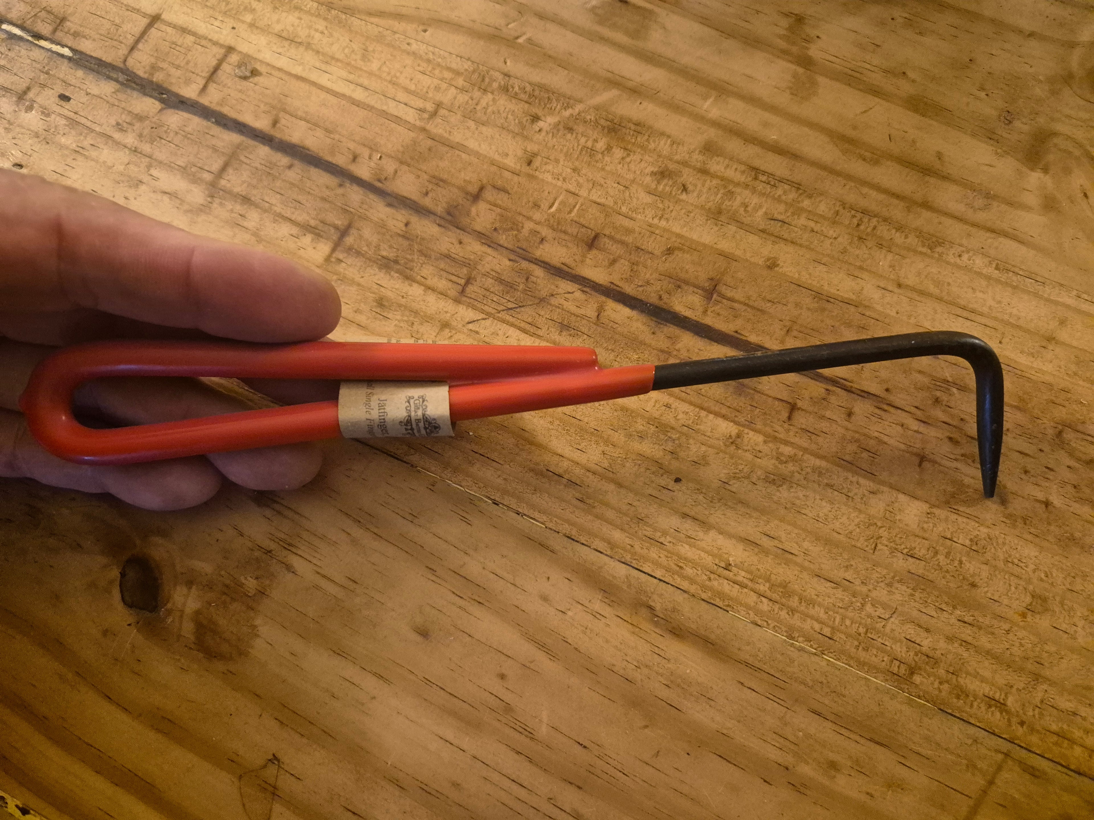 Small single finger weeder